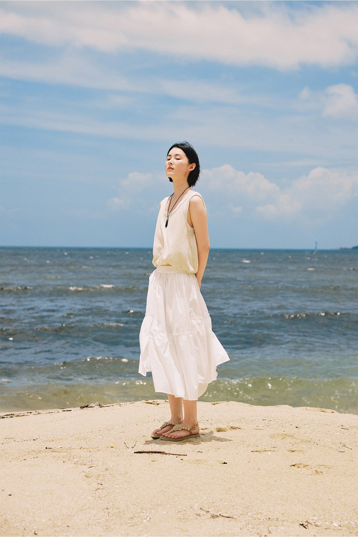 The double layer cloud blouse, ecru on cream, at the water's edge.