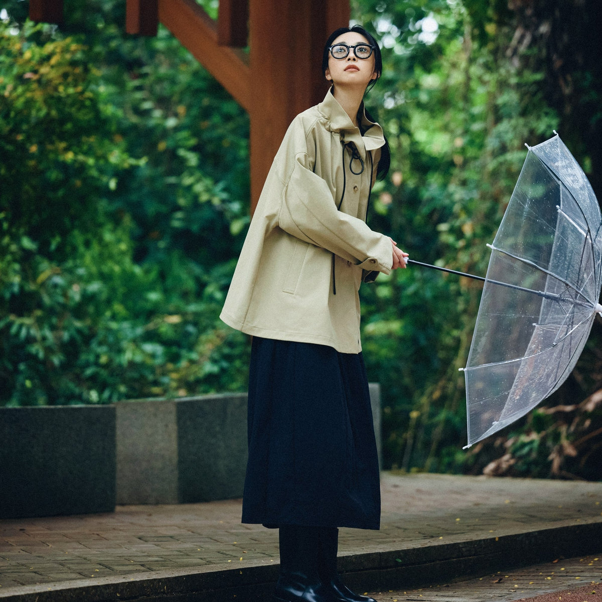 A long black corduroy flare skirt for rainy-day layering.